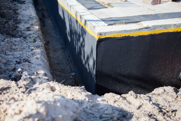 Professional Basement Waterproofing technician working in Mantua, VA